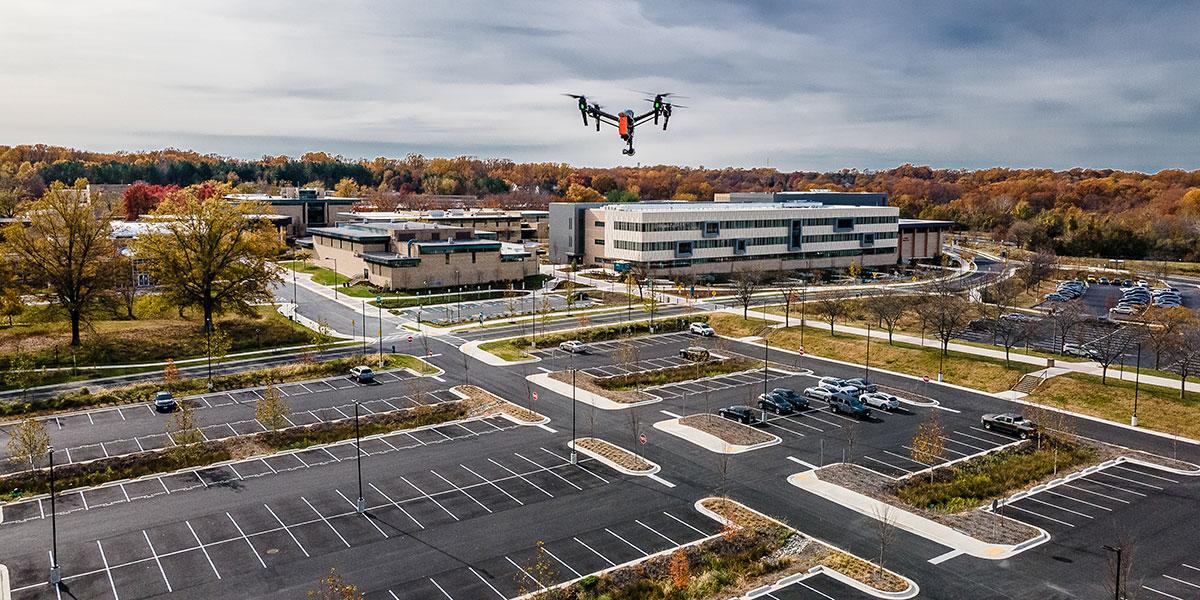 A drone flying over the AACC campus